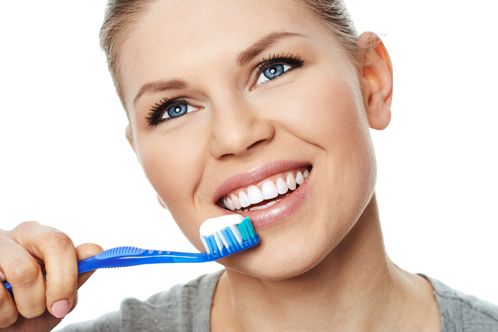 woman brushing her teeth